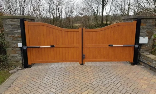 A beautifully crafted wooden automatic gate with dual electric openers, installed by Gates Wellington as part of their Electric & Automatic Gates service. A beautifully crafted wooden automatic gate with dual electric openers, installed by Gates Wellington as part of their Electric & Automatic Gates service.
